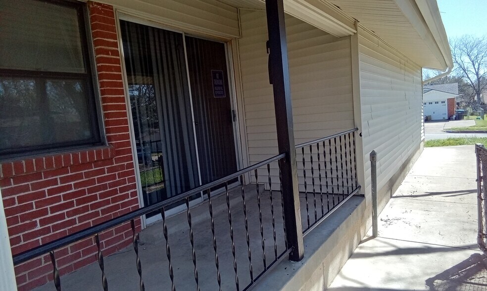 Sliding door onto side patio for outdoor seating. - 8274 Lifford Pl
