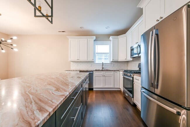 Building Photo - Beautifully Updated 3 Bedroom Home with Sunroom, Two-Car Garage, and Upscale Finishes