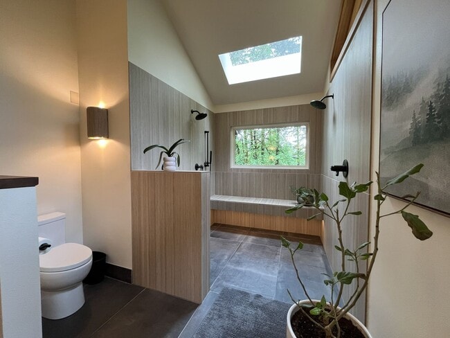 Building Photo - One-of-a-Kind Custom Home with Wall of Windows, Stone Fireplaces, Expansive Entertainment Space &...