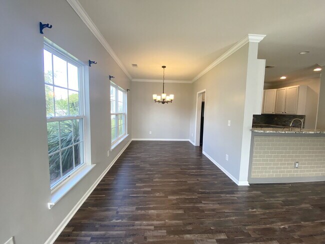 Building Photo - Three Bedroom Home with fenced-in Backyard...