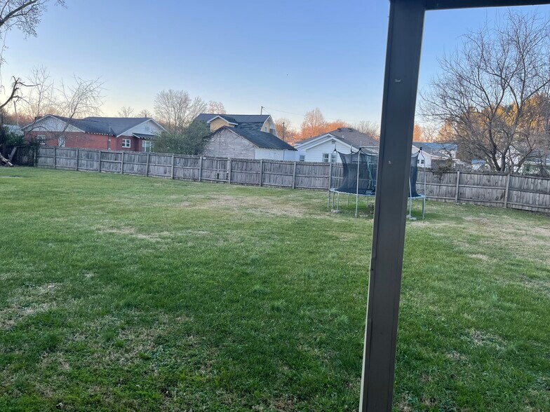 The backyard is big enough to throw a birthday party - 308 W 8th St