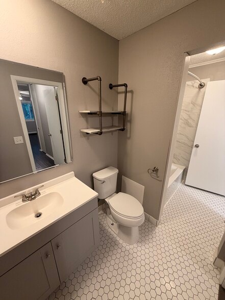 View from main bedroom threw main bath to tub/shower. - 8935 Old Cedar Ave S