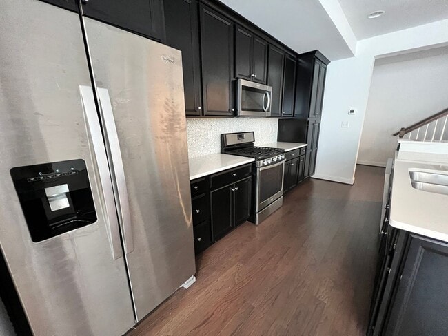 Building Photo - 2-bedroom 2.5 bath Luxury Townhome located...