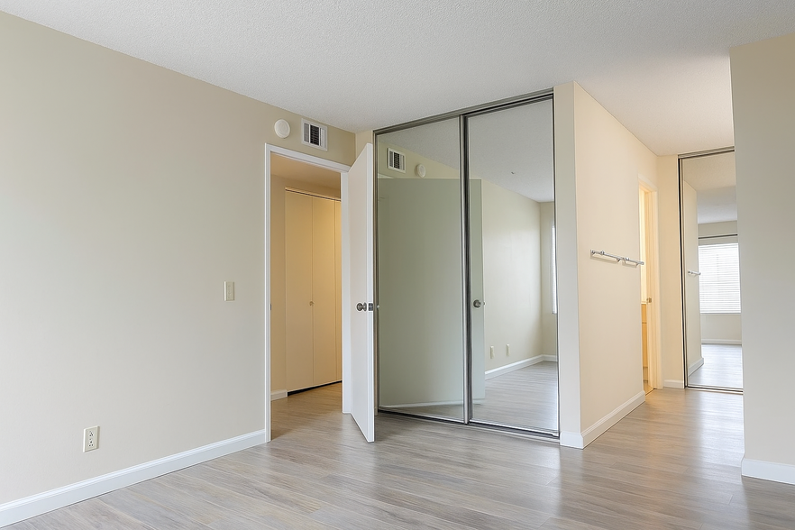 Master bedroom with vanity area and two full closets - 4800 Sawyer Ave