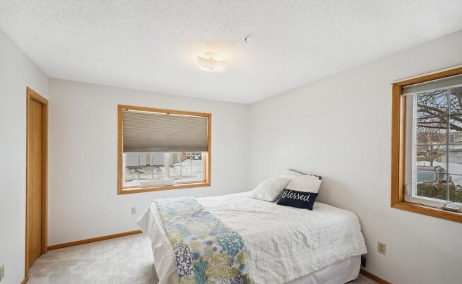 Main floor bedroom with walk in closet - 2240 Ranchview Ln N