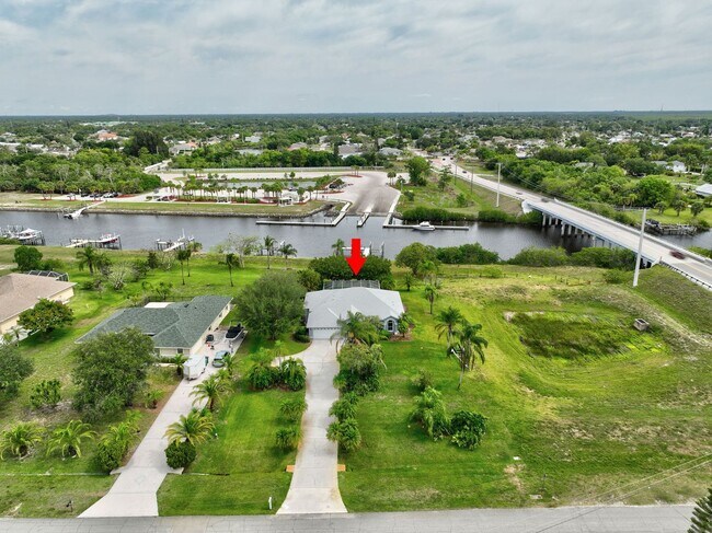 Building Photo - A BOATER'S PARADISE WITH THIS STUNNING 3 BEDROOM, 2 BATH WATERFRONT POOL HOME W/DOCK & BOAT LIFT ...