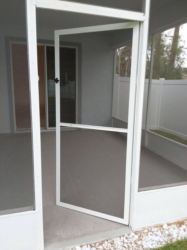 Building Photo - Like New 3 bedroom + den with French doors, screened in porch and Fenced yard and much more...