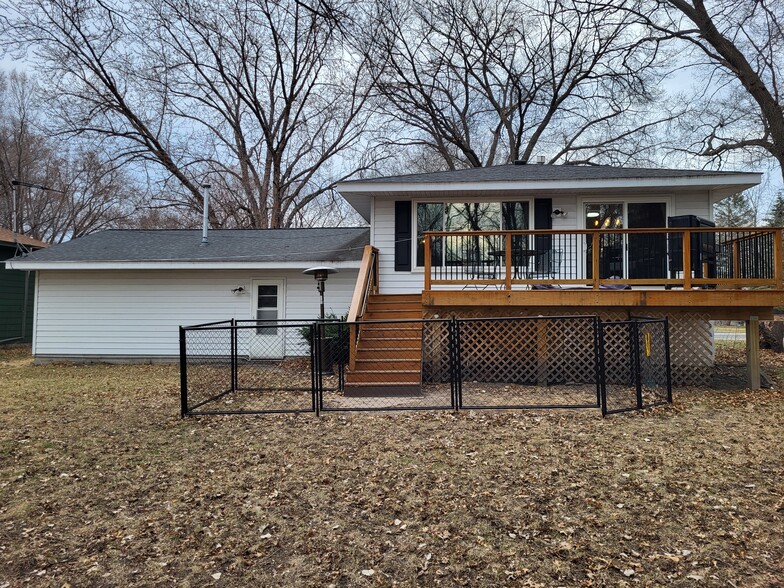 Large deck overlooking the backyard - 8460 Red Oak Dr
