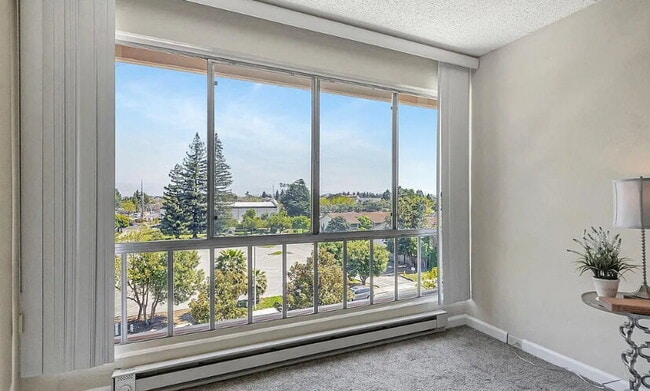 Building Photo - Spacious 1bdrm living room and bedroom with large picture windows bringing in lots of natural light.