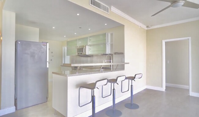 Kitchen from living area - 7601 E Treasure Dr