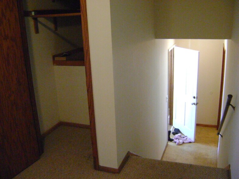 entry way hallway looking downstairs and slight view of entry way closet - 2233 5th Ave, NE