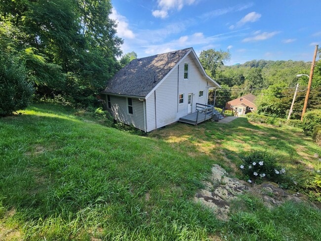 Building Photo - 4 BR home with first-floor living, new roof, and a private-feeling backyard in Lincoln Place