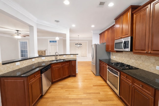 Building Photo - Gated Johns Creek Townhome Offering Space, Privacy, and Everyday Convenience