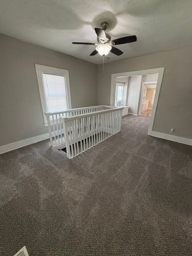 Building Photo - A cozy 2 bedroom home with versatile living space and plenty of storage including a partially fin...