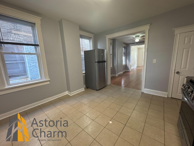 Building Photo - Comfortable 3-Bedroom with Hardwood Floors...