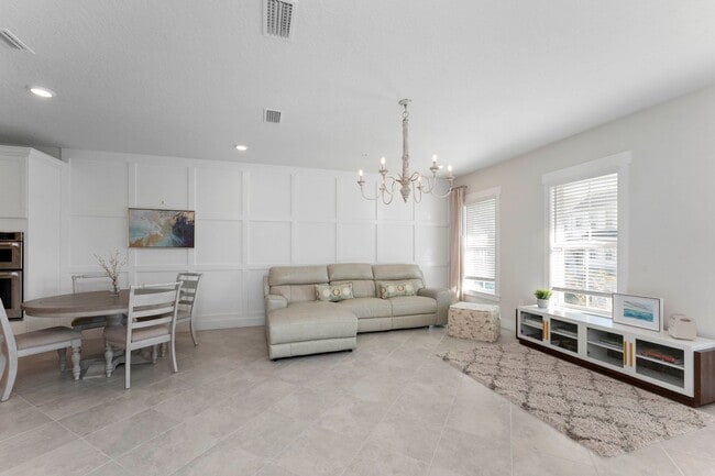 Building Photo - Introducing a captivating 3-story townhome...
