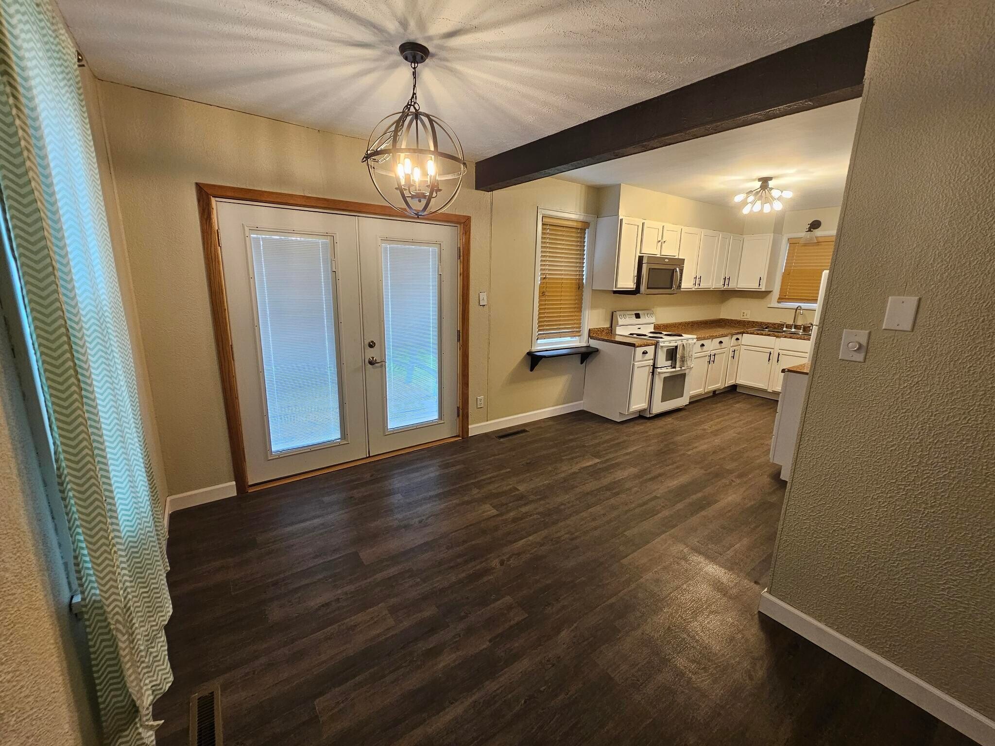 French doors onto rear deck. - 606 Tindolph Ave S