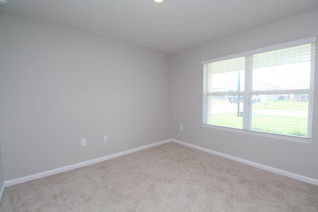 Building Photo - Coming Available Soon – 4BR/2BA Brick Home with Open Floor Plan, Solar Panels & 2-Car Garage in L...