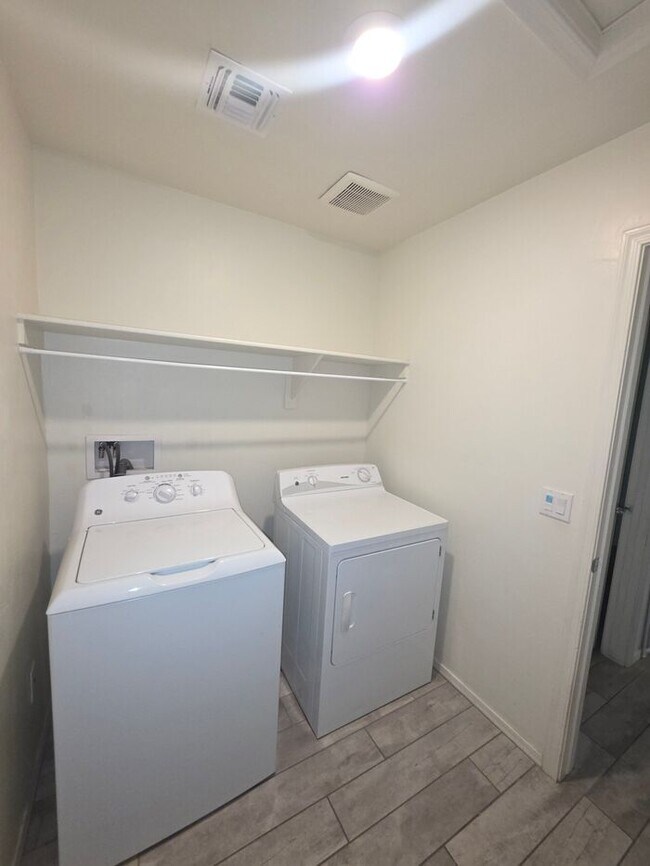 Building Photo - COMING SOON! New 3BR 2 BA Home w/ 2-Car Garage • Stainless Kitchen • Timer-Irrigated Yard in East...