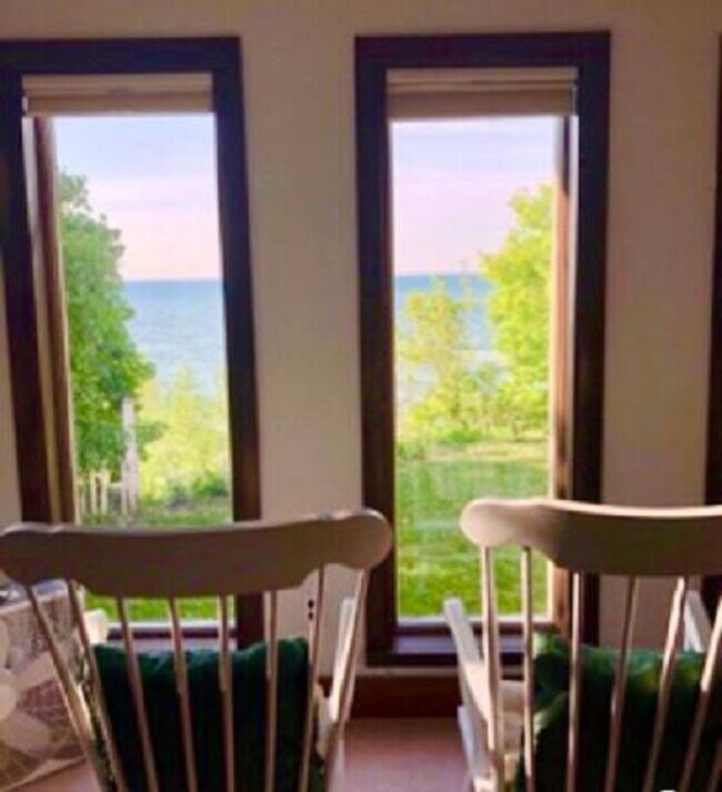 Seven front windows overlook the lake - 3061 Maple Ave