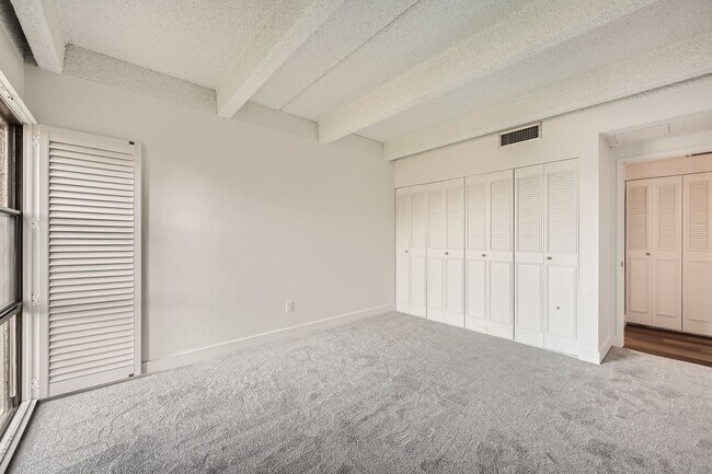 Building Photo - Completely Updated 2 Bedroom 2 Bathroom Condo Available NOW! Garage Parking Included!