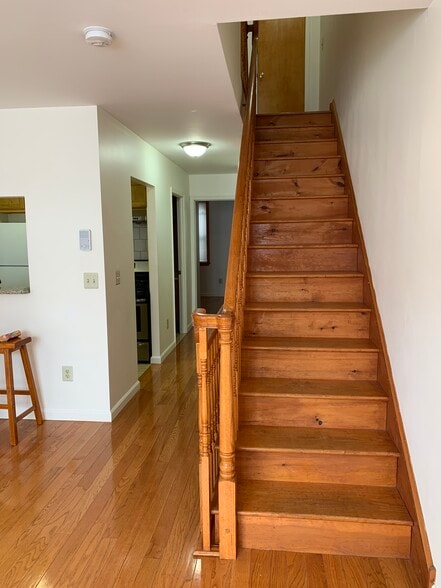 Stairs to 3rd floor (lights off) - 1229 Wood St