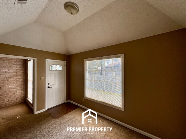 Building Photo - Spacious 3BR/2BA Near Southwind | 1,958 Sq Ft, Brick Fireplace, 2-Car Garage & Quiet Cove