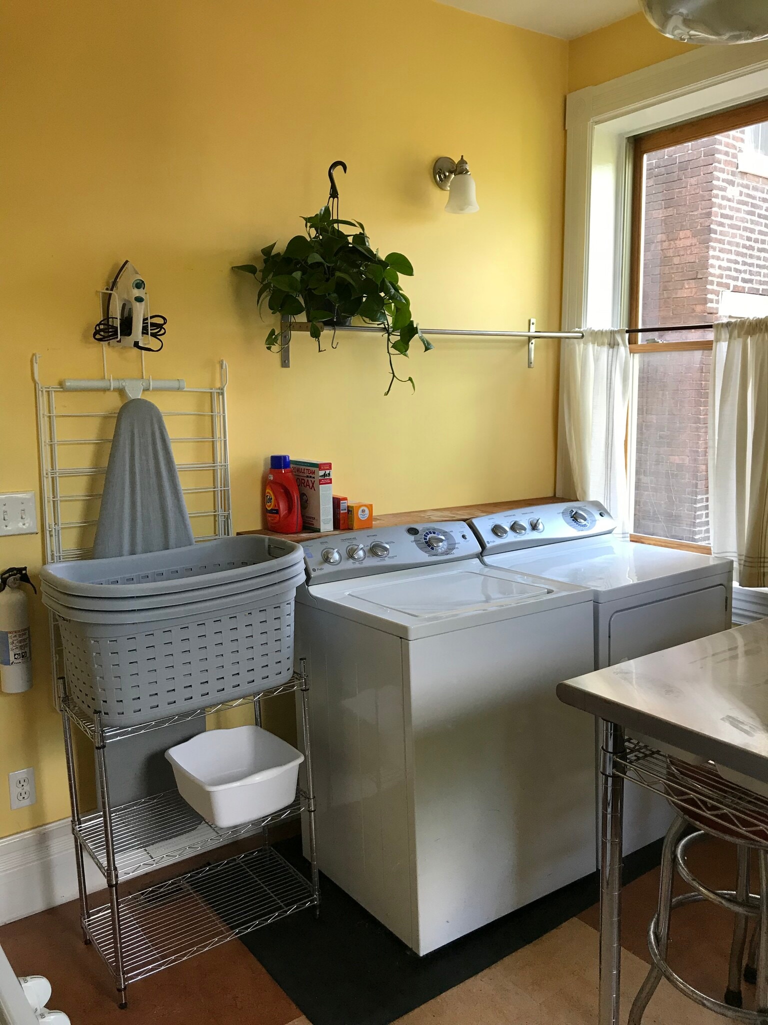 Laundry includes washer, dryer, ironing board, iron, laundry baskets, drying rack, and clothespins - 3284 Dawson Street