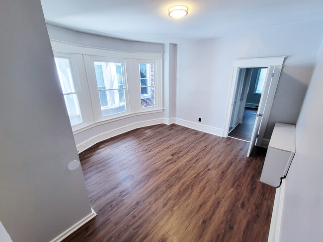 Bedroom with bay window and closet. Image 1. - 1242 S 51st St