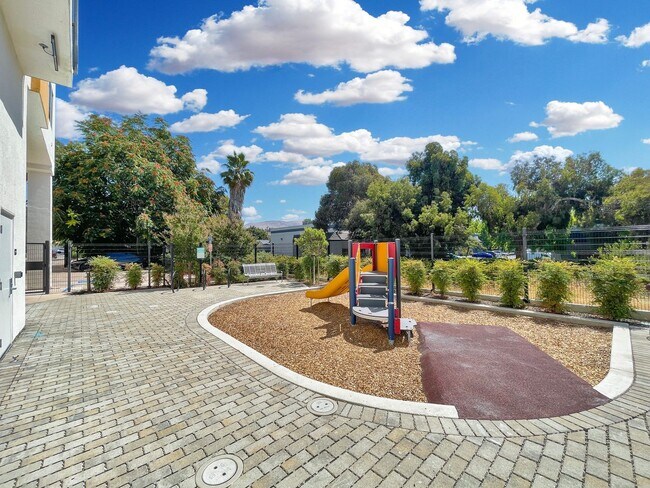 Building Photo - Modern 2BD Fremont Condo – EV Charger, Bal...