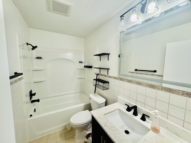 Building Photo - "Charming 4-Bedroom Home with Granite Elegance & Hardwood Warmth in Savage!"