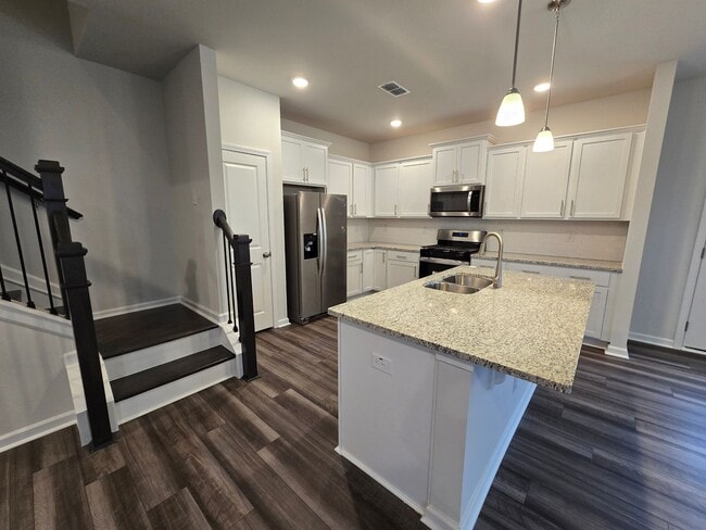 Building Photo - NEWLY BUILT END UNIT TOWNHOME