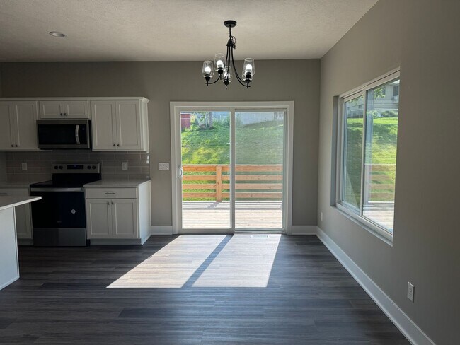 Building Photo - Luxury Bennington Townhome Ready For Move In