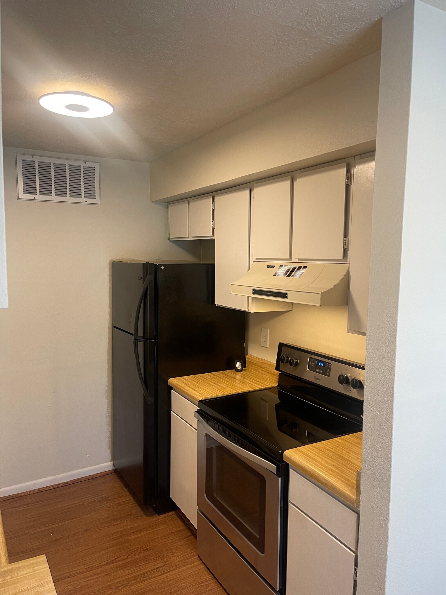 Upgraded appliances throughout kitchen. New microwave being installed to replace vent hood. - 4441 Old College Rd