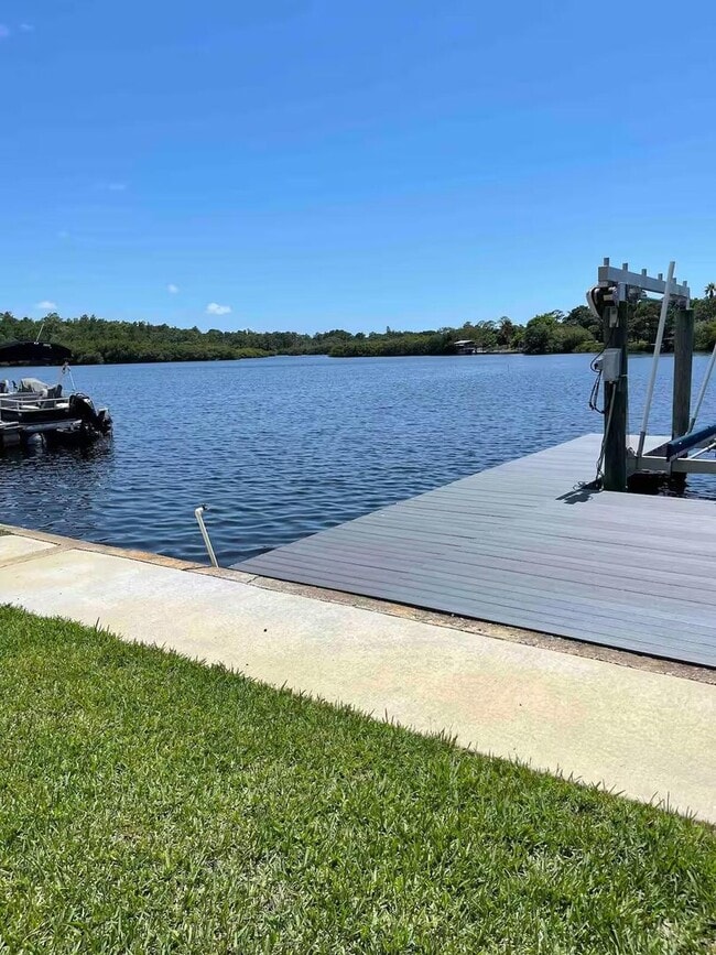 Building Photo - 4 Bed/2 Bath Waterfront Paradise with Pool, Dock & Gulf Access in Baileys Bluff