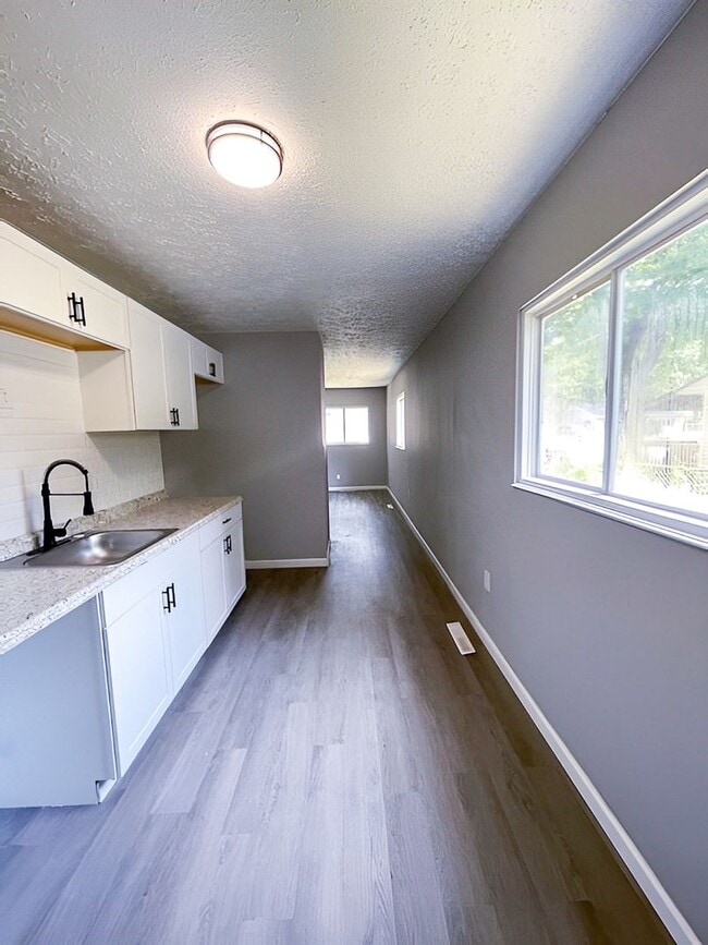 Building Photo - Charming 3-Bedroom Single-Family with New Kitchen, Large Yard & Off-Street Parking!