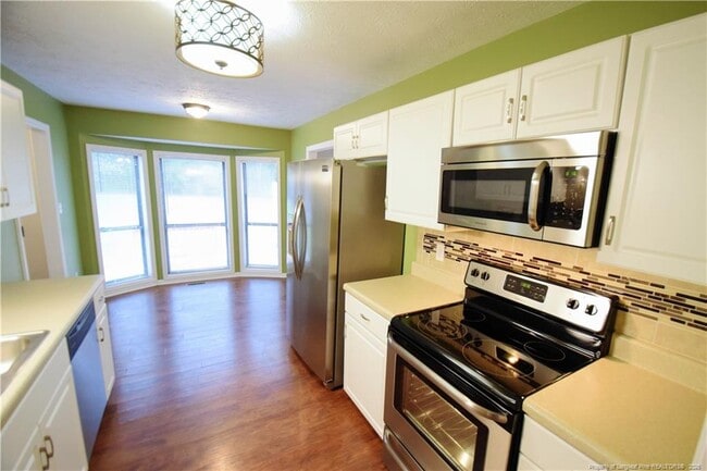 Building Photo - 6933 Woodmark Dr