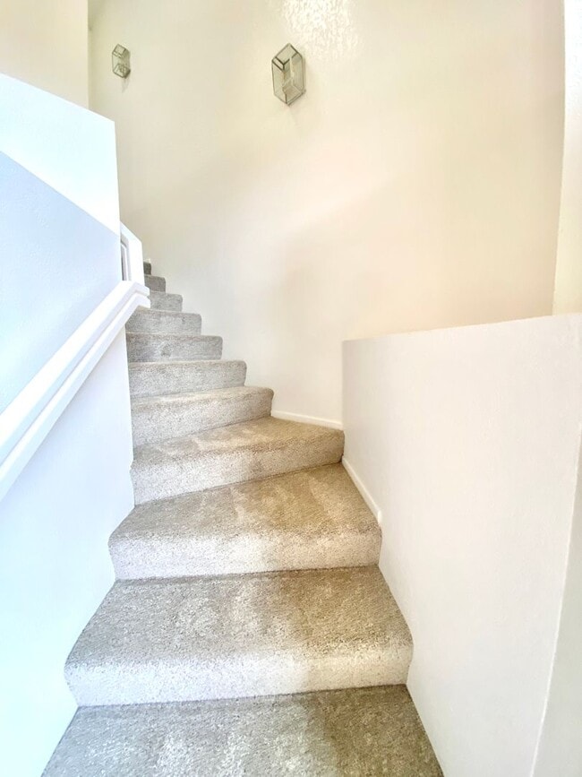 Building Photo - NEW PRICE! Spacious 3bdrm 2.5bath Condo w/2 car garage & private laundry hookups, community Pool ...