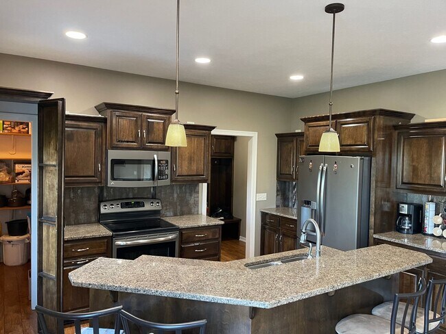 Building Photo - Spacious 4-Bedroom with Office, Drop Zone,...