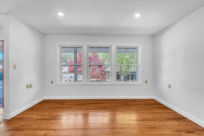 Building Photo - Charming home with large garage & attached...