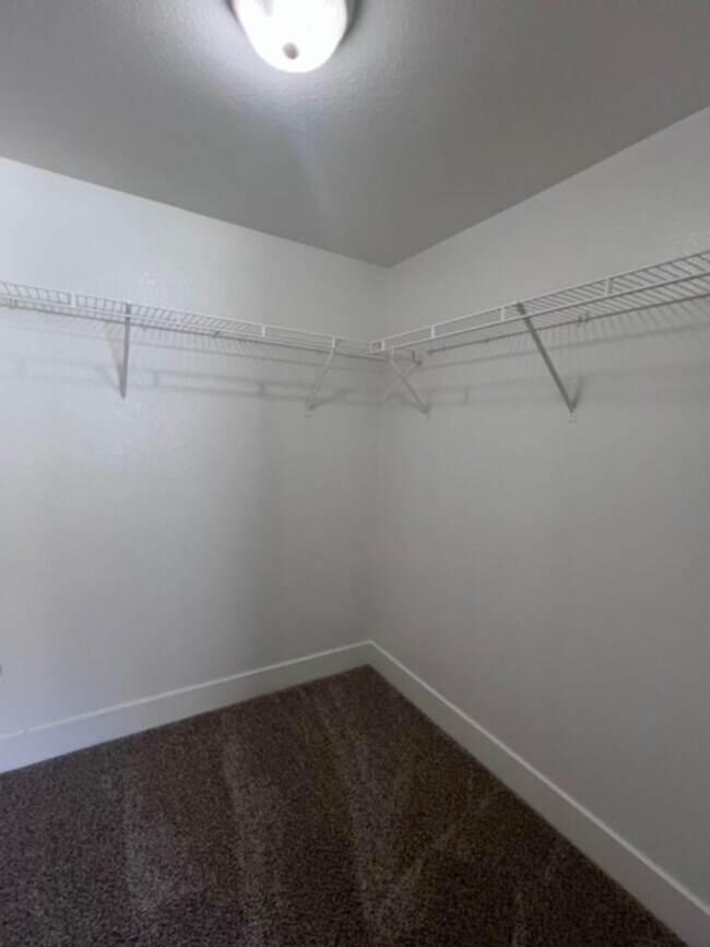 Building Photo - Three bedroom townhouse with 2 car garage