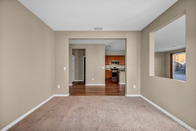 Building Photo - Sun-Filled, Spacious Living with a Three-Car Garage