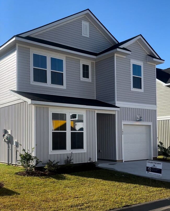 Building Photo - Brand New 4BR 3BA Home Close to the beach • Open-Plan Main Level • Patio in Little River!