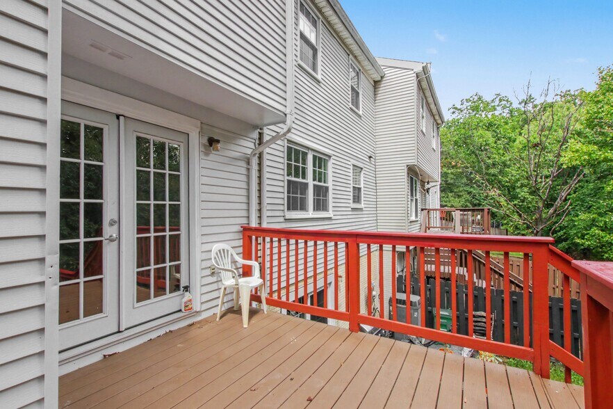 Rear deck with stairs to patio - 8481 Snowden Oaks Pl