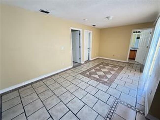 Building Photo - Charming 3-bed, 2-bath POOL home with 2-car garage. Features ceramic tile flooring, updated kitch...