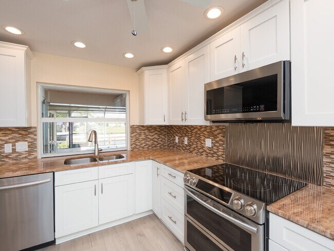 Building Photo - 3 BEDROOM • 2 BATHROOM • PRIVATE POOL • WATERFRONT • BOAT LIFT • ZERO DEPOSIT MOVE-IN AVAILABLE