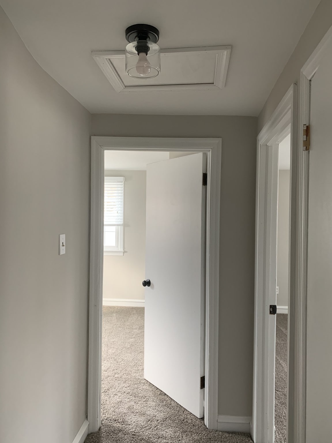 Hallway looking at both bedroom doorways - 1310 W Kings Hwy