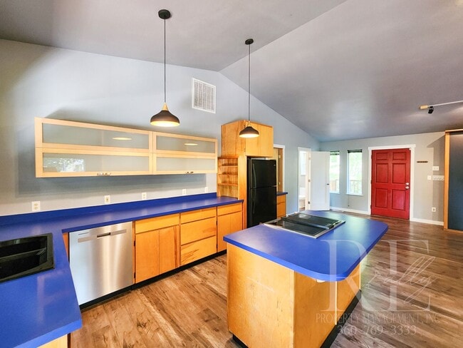 Building Photo - Vaulted Ceilings, Unique Designer Kitchen & Expansive Half-Acre Setting with Flexible Living Spaces