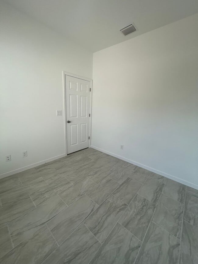 Building Photo - BRAND NEW Modern 4BR/2BA Home with Garage – Peaceful Lake Placid Retreat