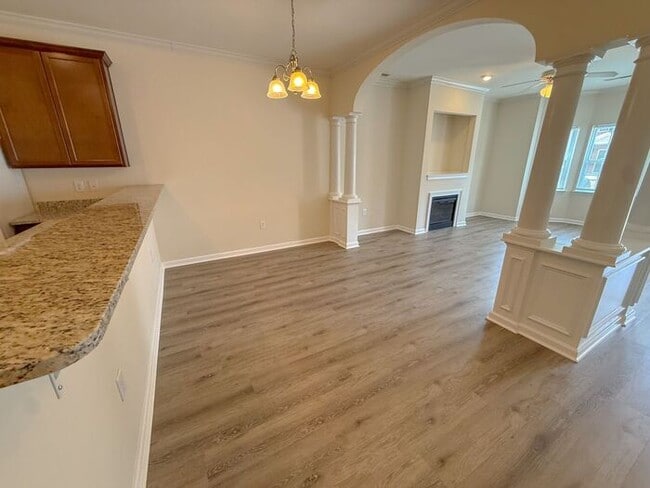 Building Photo - Beautifully updated Townhome! New cabinets, granite counter tops, and LVP flooring through downst...